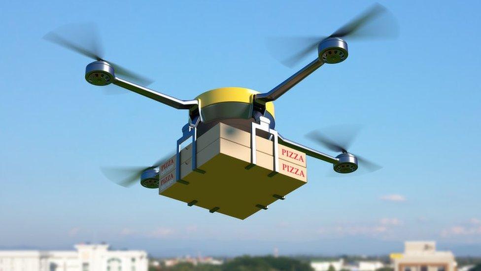 Mock-up drone delivering two pizzas