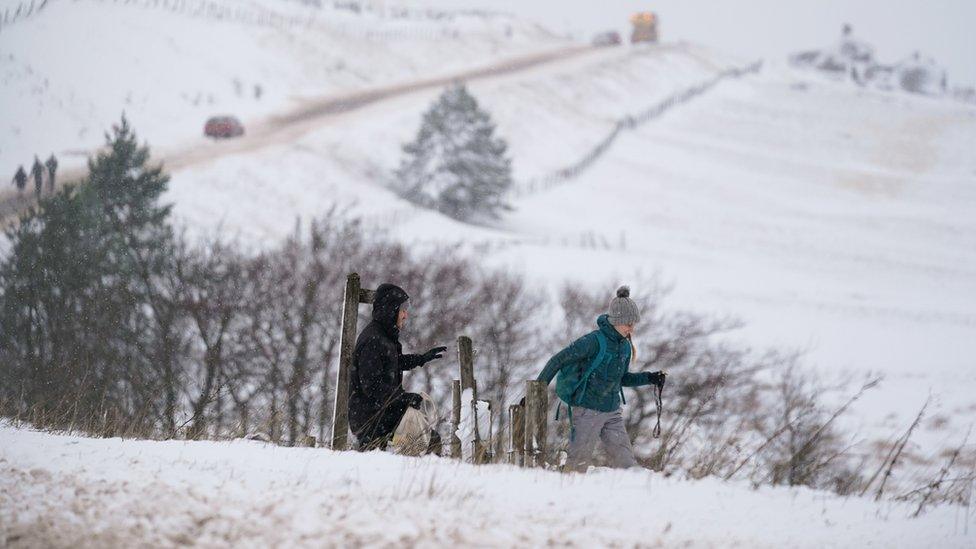 Man and woman rambling in snow