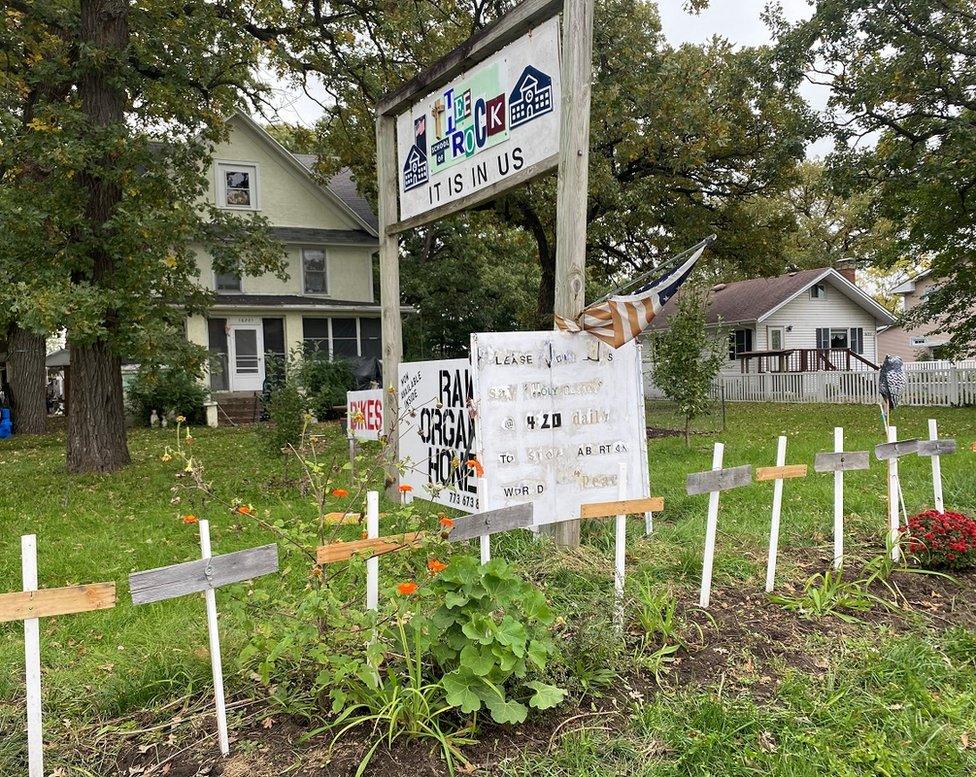 Wooden crosses outside the house where the stabbings occurred