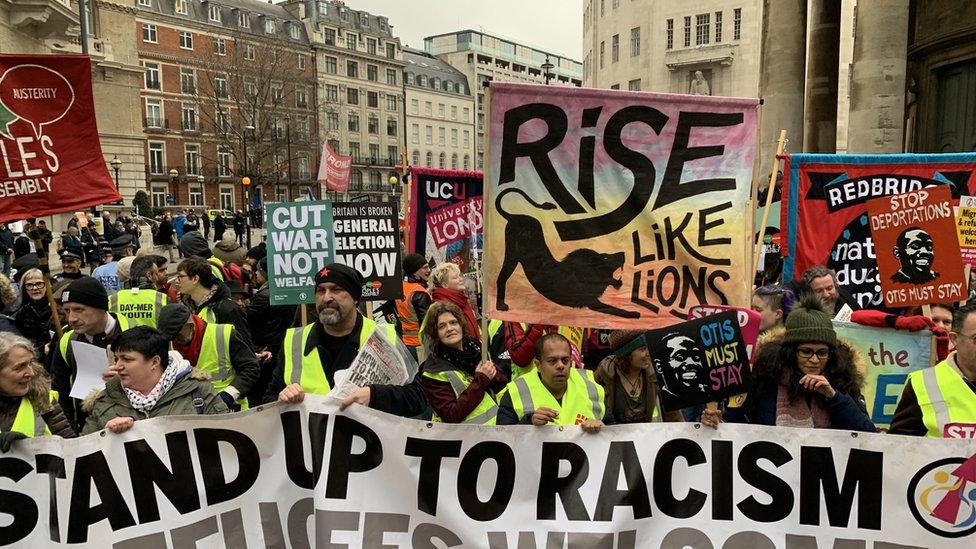 Crowds protesting against austerity in yellow vests