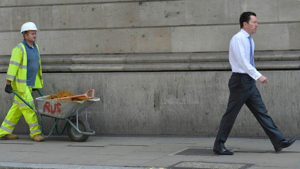 Construction worker and man in a suit