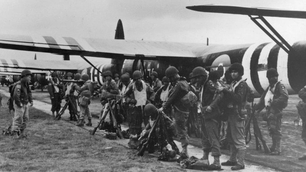 American troops from the 82nd Airborne Division check their equipment on D-Day (June 6, 1944)