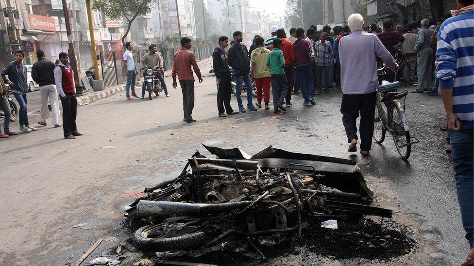 Protesters have burned shops and motorcycles