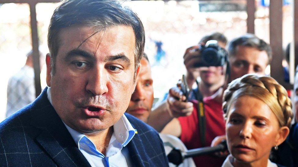 Former Georgian President Mikheil Saakashvili (L) and former Ukrainian Prime Minister Yulia Tymoshenko are seen at the railway station in Przemysl, Poland, close to the Ukrainian border on September 10, 2017