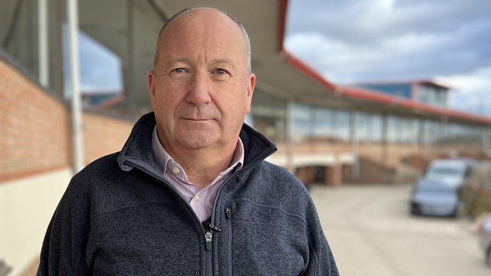 Development Delivery Director Andy Girvan in front of the stadium