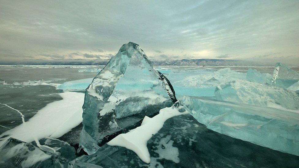 A single block of ice with a blue tint