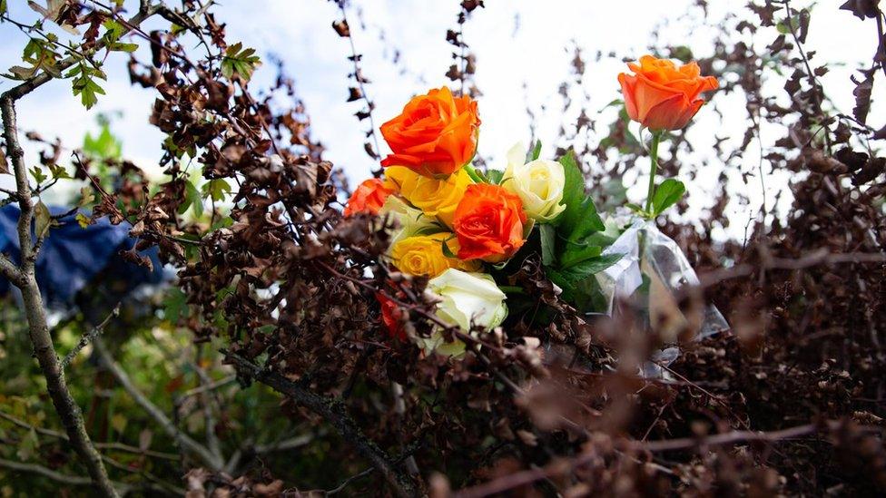 Flowers left at crash site