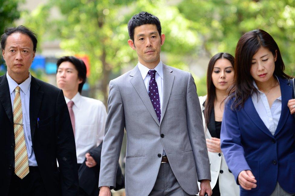 Japanese men and women walking down the street