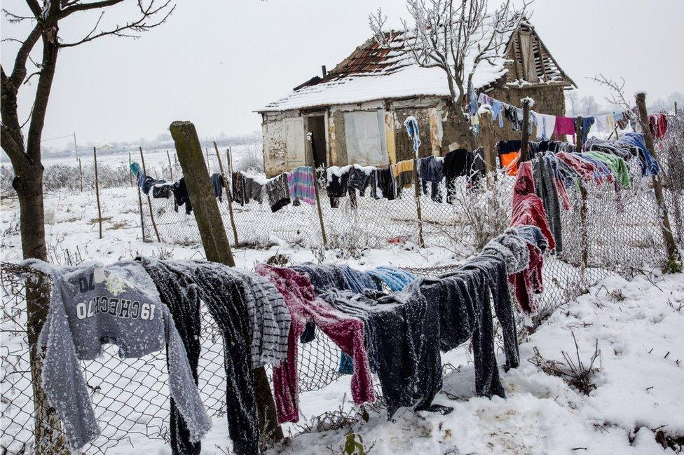 Snow-covered clothes hanging to dry