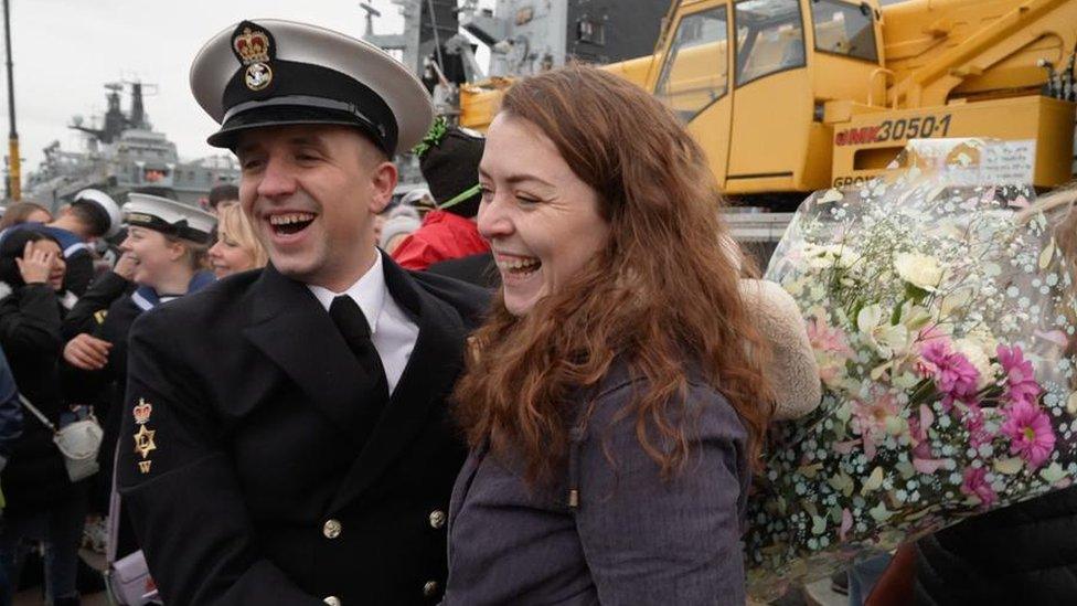 Sailor and partner celebrate being reunited