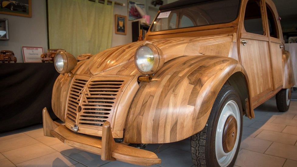 A Citroen 2 CV made out of fruitwood