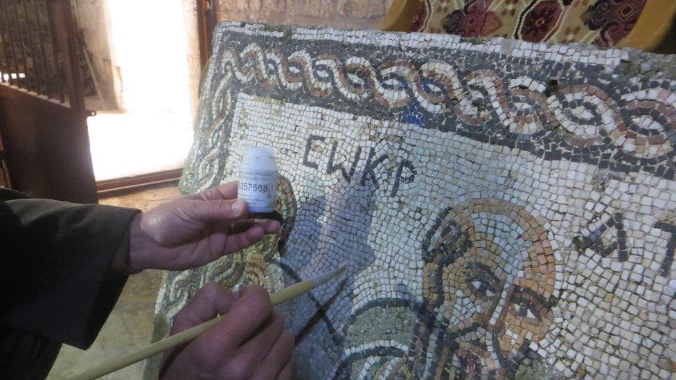 An ancient mosaic is painted with an invisible liquid that is detectable under ultra-violet light