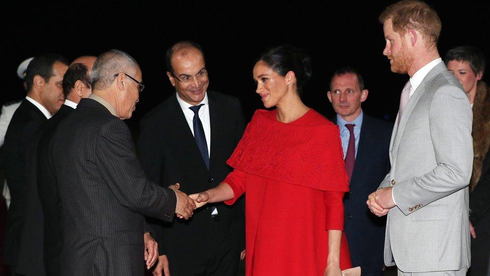 Meghan and Harry are greeted by officials