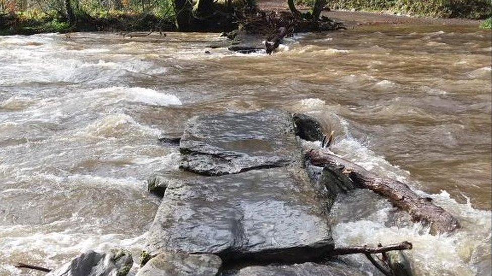 Damaged Tarr Steps under water