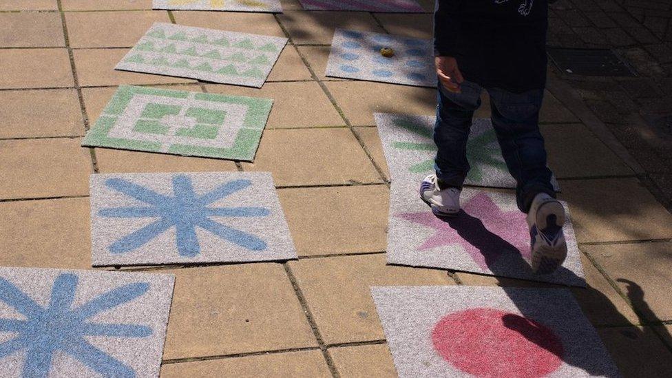 Child doing hopscotch