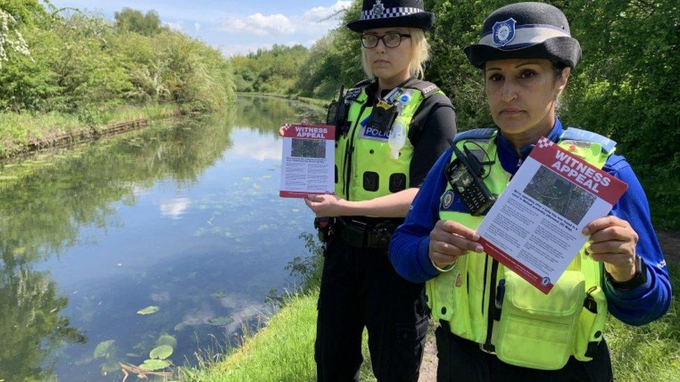 Police officers with leaflet appeals