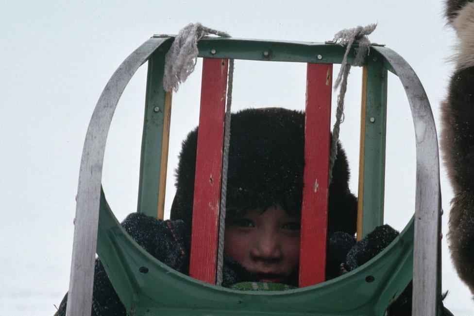 A young Chukchi child with a sledge