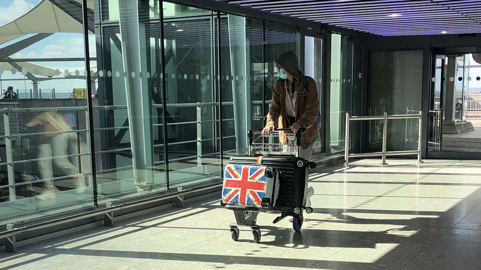 Person with mask in quiet airport