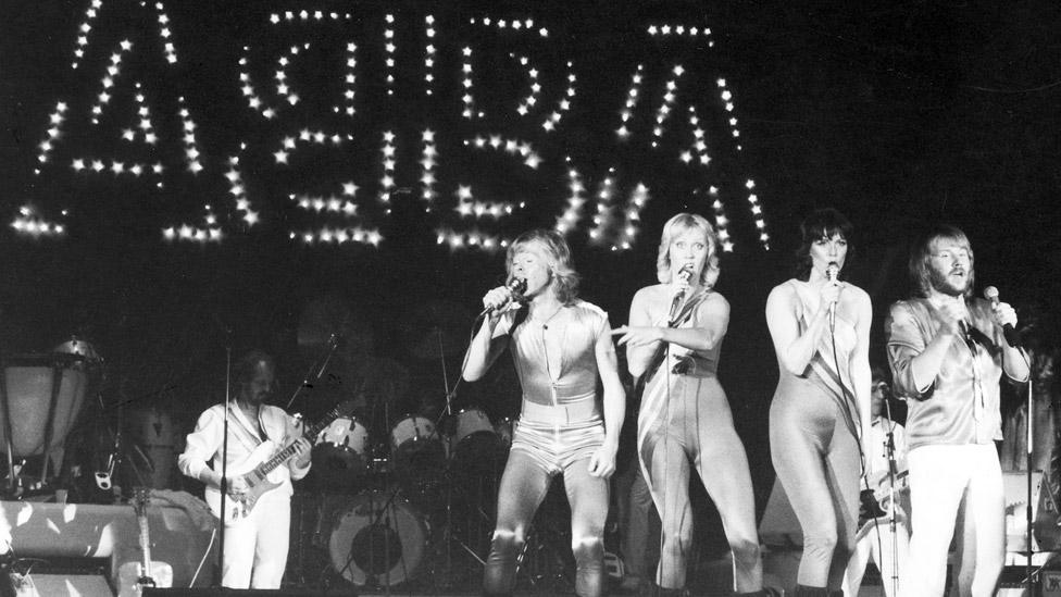 Lasse Wellander (left) with Abba on stage in 1980