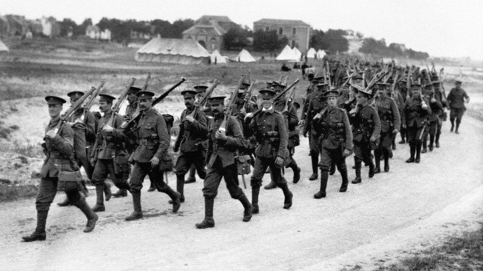 British infantrymen on the march towards the front lines in the River Somme valley.