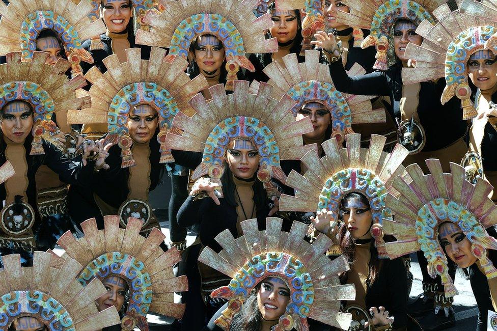 Women dressed in costumes wait for start of Day of the Dead parade along Mexico City's main Reforma Avenue, Saturday, Oct 29 2016