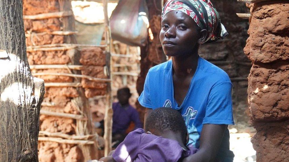 Woman in Kenya holding child