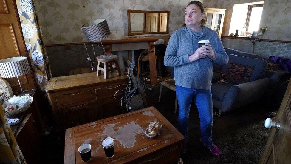 Kim Clark inside her flood damaged home in River Street