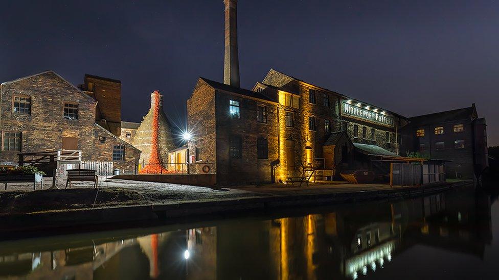 A photo of a pottery works at the side of a canal titled "Middleport Pottery with the Weeping Willows" - voted first in Preliminary Open Projected