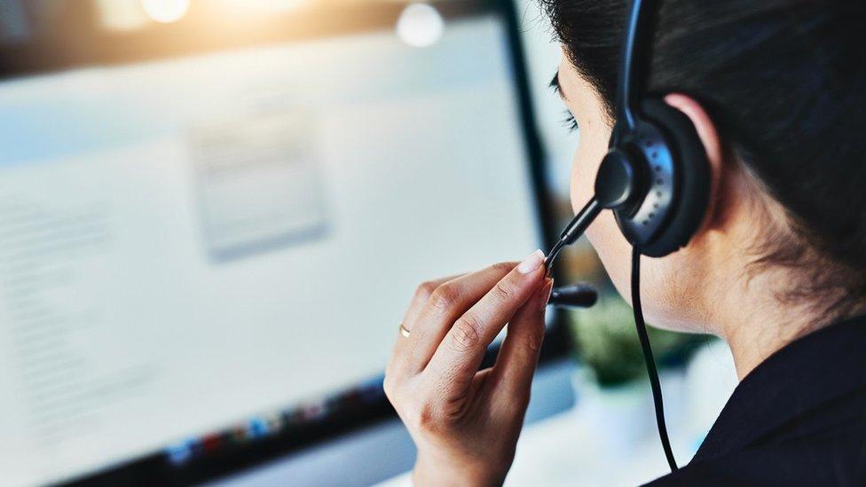 Women talking on telephone headset