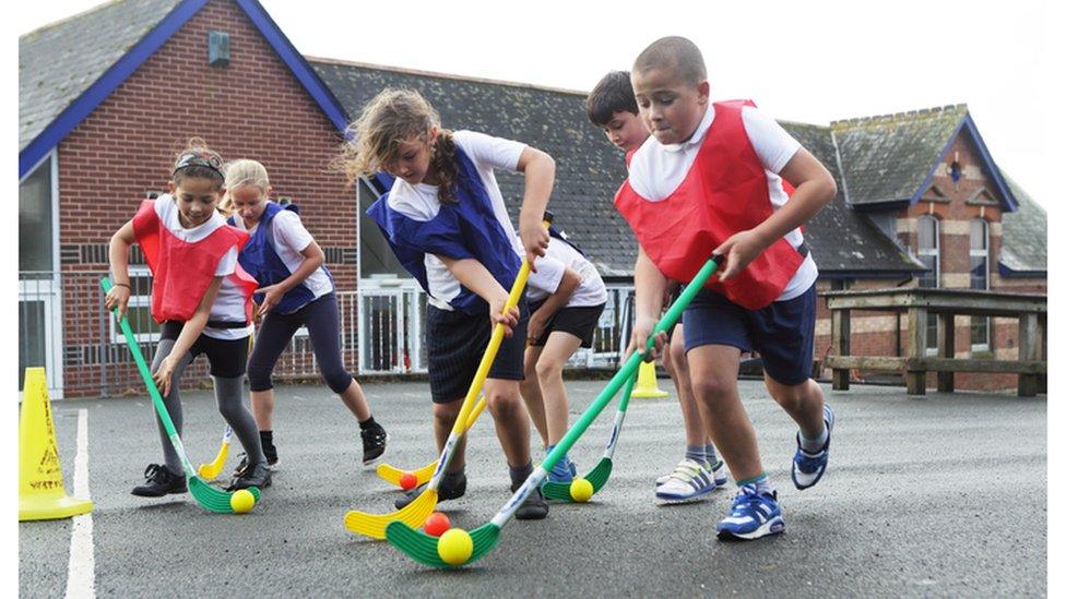 Children playing hockey