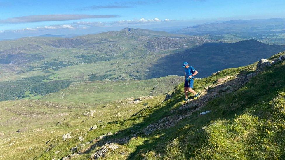 Ross Jenkin walking down a hill