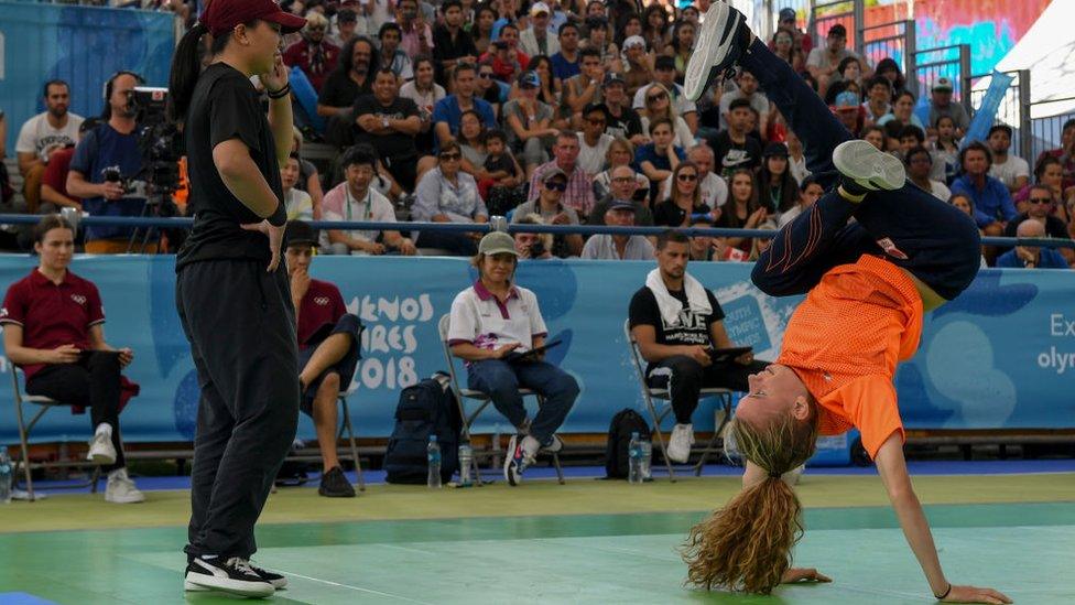 Netherland's b-girl Vicky (R) competes against Japan's b-girl Ram during a battle at the Youth Olympic Games in Buenos Aires