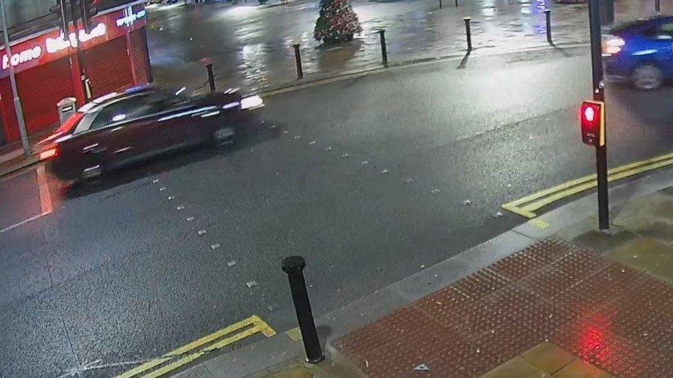 CCTV grab of red Audi