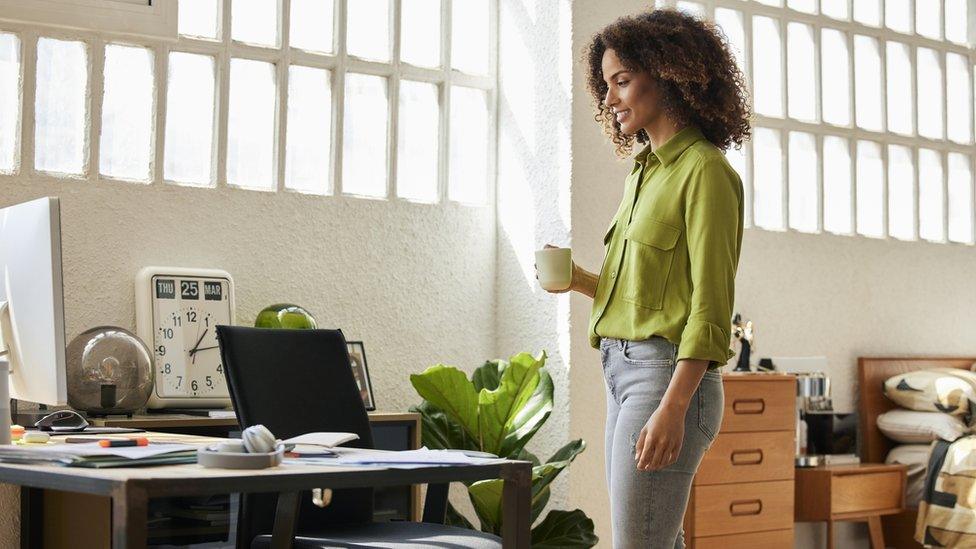 Woman walking around apartment