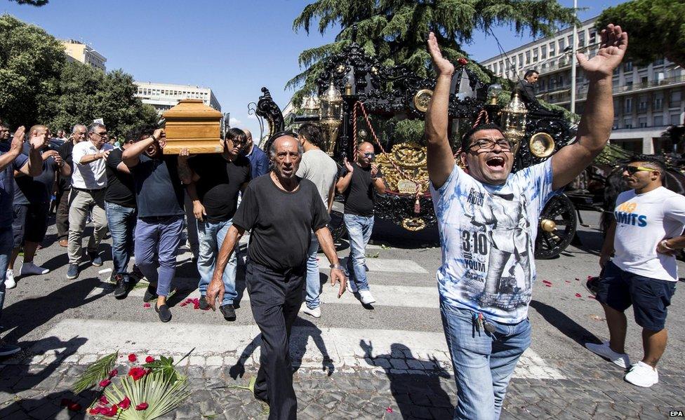 People attend the funeral procession of alleged mafia member Vittorio Casamonica, outside Don Bosco church in Rome, Italy, 20 August 2015