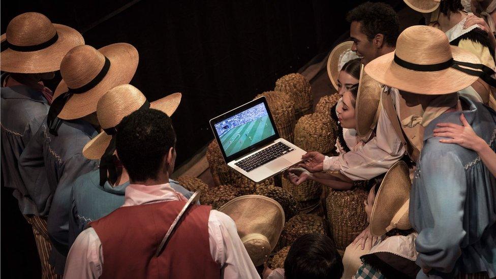 Members of Birmingham Royal Ballet dancers watch the England v Sweden World Cup match in the wings