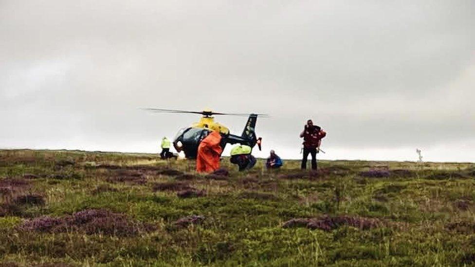 People being helped to safety