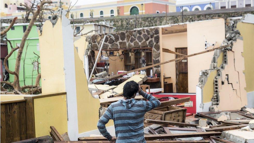 Image shows damaged homes after Hurricane Maria made landfall on 21 September 2017 in San Juan, Puerto Rico