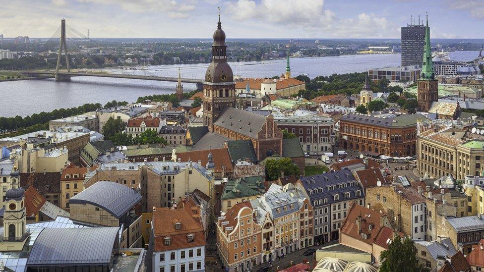 A view over central Riga, Latvia, with Riga Cathedral and Daugava River in the background.