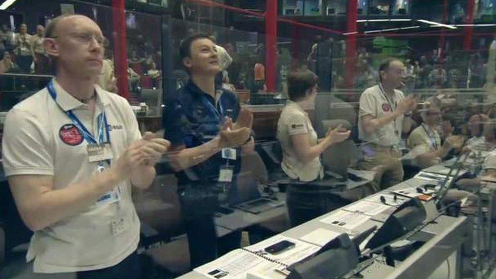 Applause from mission control