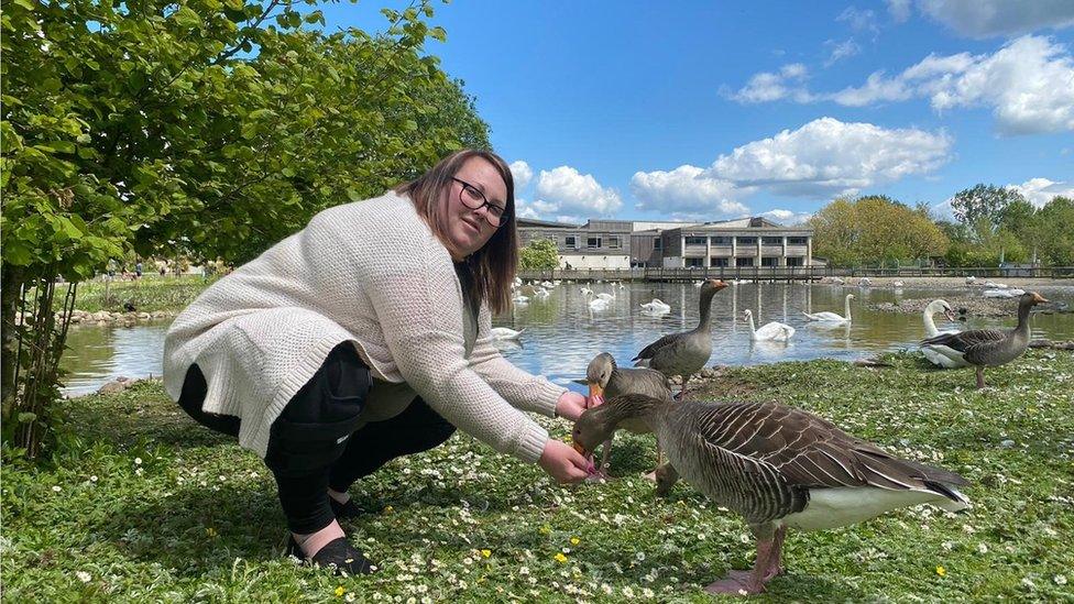 Becca Gannaway-Pitts feeding ducks