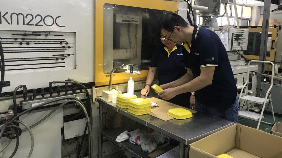 Workers at Watson EP Industries' factory in Singapore