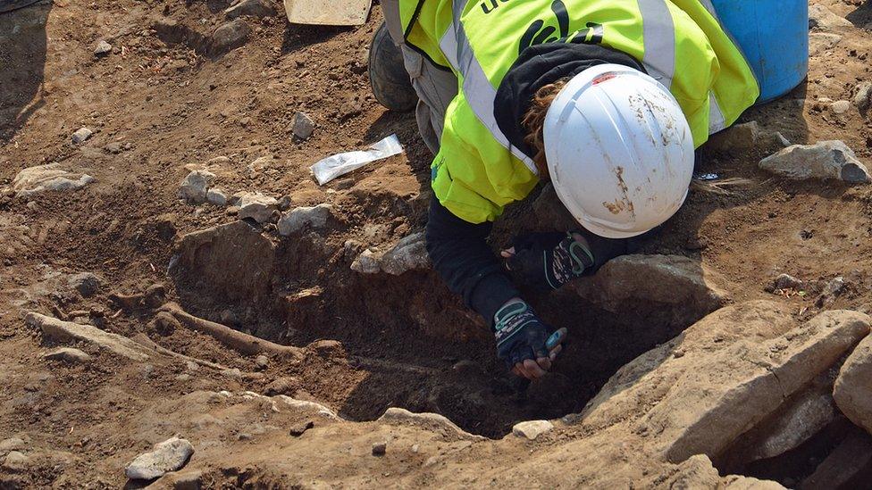 One of the cist graves being unearthed