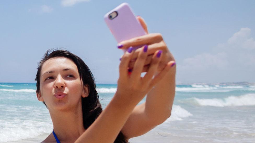 Woman taking selfie