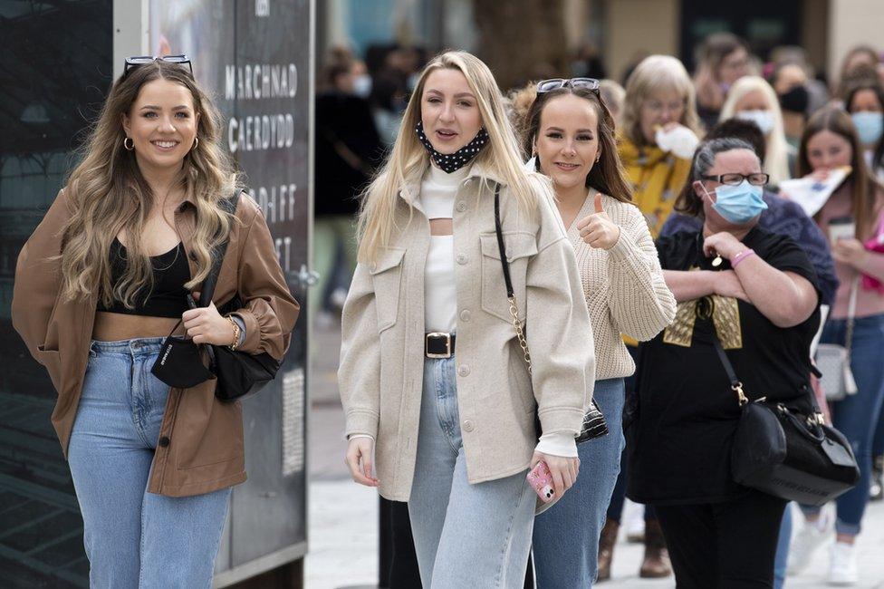 A group of women queue outside Primark