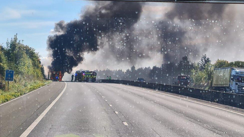 Smoke rising from a lorry on fire on the M4