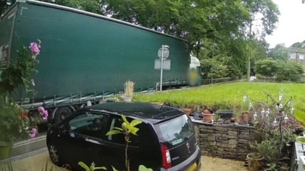 A lorry on a narrow street