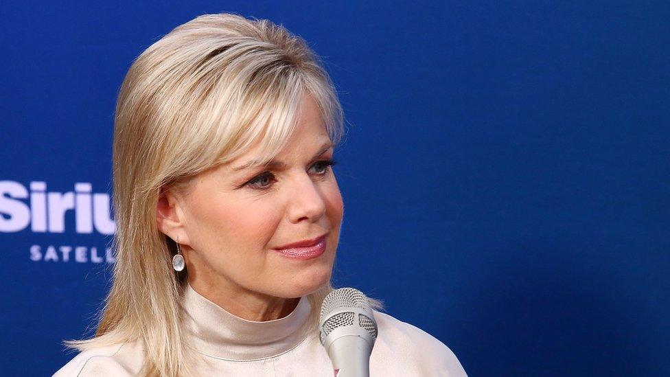 Gretchen Carlson sits in front of a microphone for a radio interview