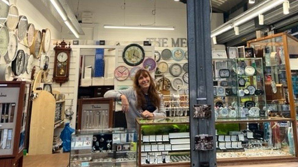 Image of Linda Aston behind the counter of her stall