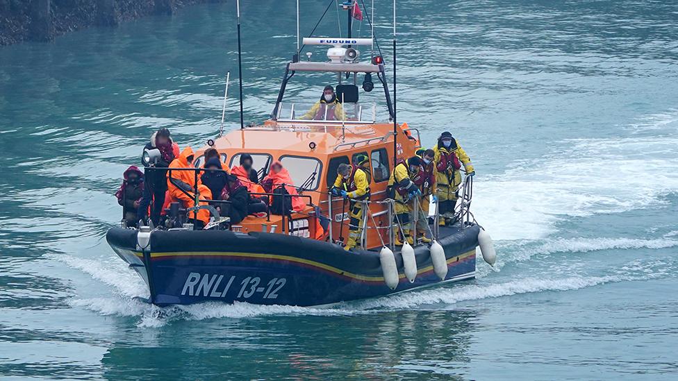 A group of people thought to be migrants are brought in to Dover, Kent, onboard an RNLI vessel following a small boat incident in the Channel. Picture date: Friday March 4, 2022.